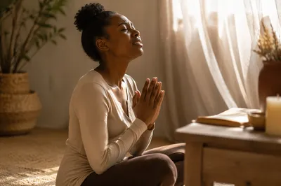 Young Woman Kneeling in Prayer Indoors