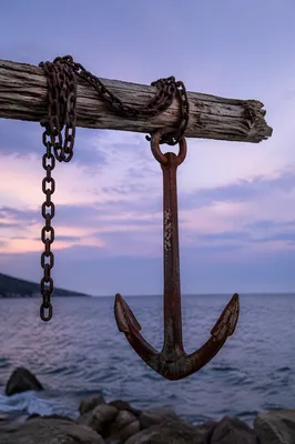 Weathered Anchor Cross by Twilight Sea