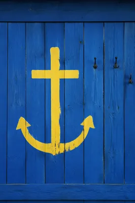 Yellow Anchor Cross on Blue Wooden Planks