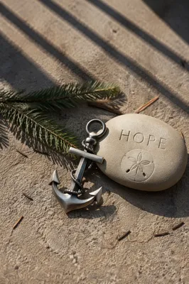 Anchor Cross Hope Charm on Concrete