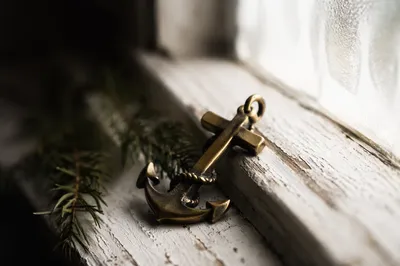 Brass Anchor Cross by Frosted Window
