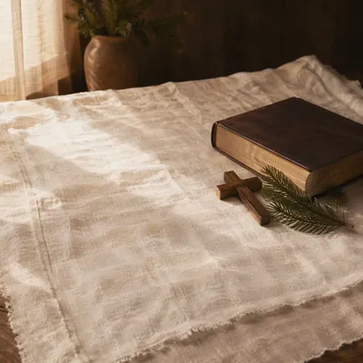 Bible and Wooden Cross on Linen
