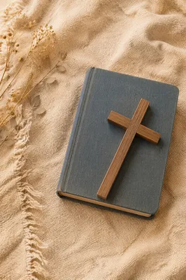 Bible and Wooden Cross on Linen