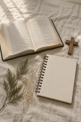 Open Bible and Wooden Cross on Linen