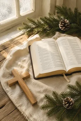Open Bible and Wooden Cross on Linen