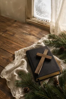 Bible and Wooden Cross on Winter Linen