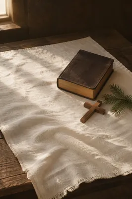 Bible and Cross on White Linen