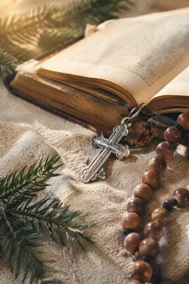 Open Bible with Cross on Linen