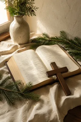 Open Bible and Cross with Evergreen