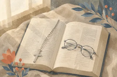 Open Bible with Silver Cross on Linen