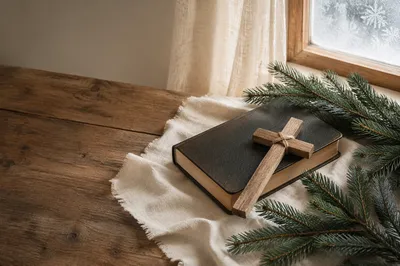 Bible and Wooden Cross on Winter Linen