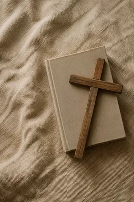 Bible and Wooden Cross on Linen