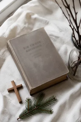 Bible and Wooden Cross on Linen