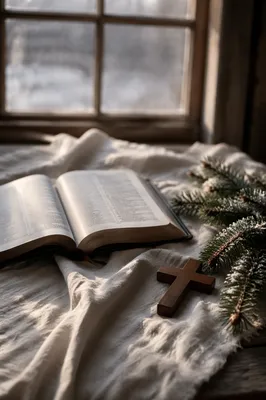Open Bible and Wooden Cross on Linen