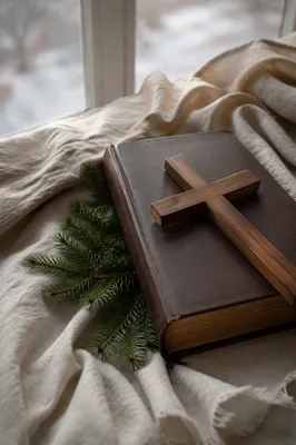 Bible and Wooden Cross on Linen