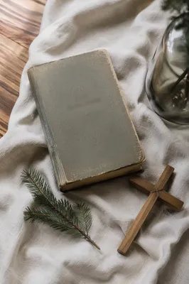 Bible and Wooden Cross on Linen