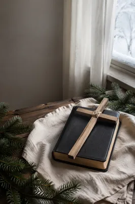 Bible and Wooden Cross on Linen