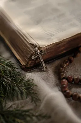Open Bible with Cross on Linen