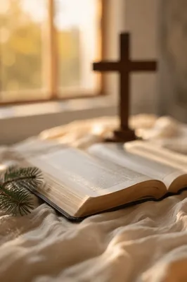Open Bible and Cross on Linen