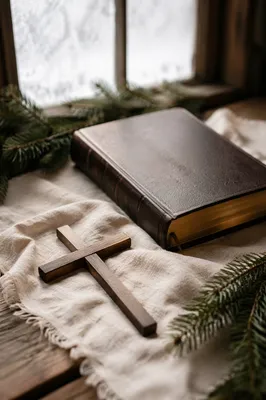 Bible and Wooden Cross on Linen