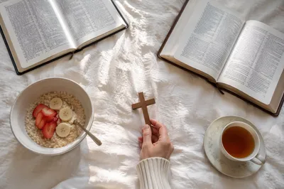 Bible and Wooden Cross on Linen