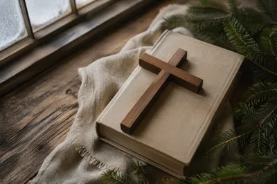 Wooden Cross and Bible on Linen