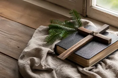 Bible and Wooden Cross on Linen
