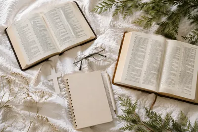 Open Bibles and White Cross Flat Lay
