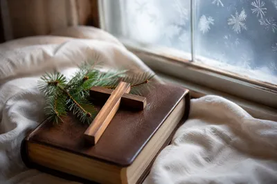 Bible and Wooden Cross on Linen