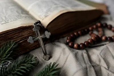 Bible and Cross on Linen with Evergreen