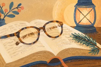 Open Bible with Reading Glasses in Warm Light