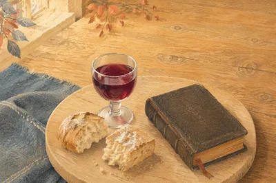 Communion Bread and Wine on Walnut Table