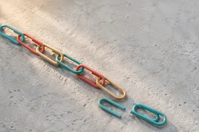 Broken Paper Clip Chain Symbolizing Freedom
