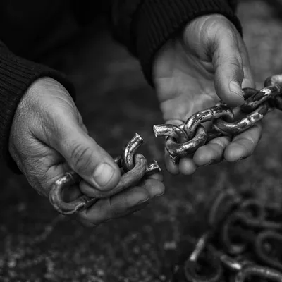 Broken Chains Held in Resilient Hands