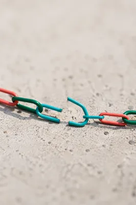 Broken Paper Clip Chain Symbolizing Freedom