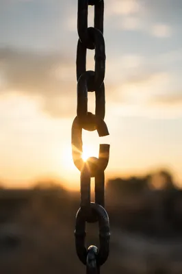 Broken Chain Link in Golden Sunrise