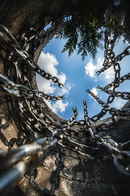 Broken Chains Opening to Hopeful Sky