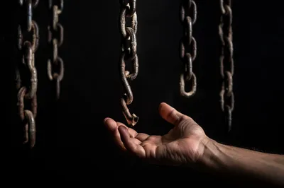 Broken Chains and Reaching Hand of Freedom
