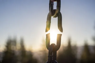 Broken Chain Link in Golden Sunlight