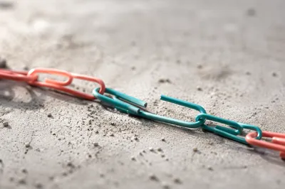 Broken Paper Clip Chain Symbolizing Freedom