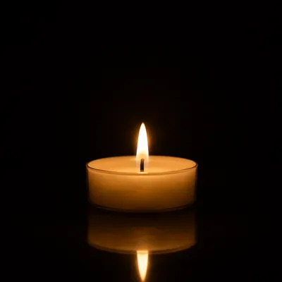 Burning Candle in Quiet Darkness