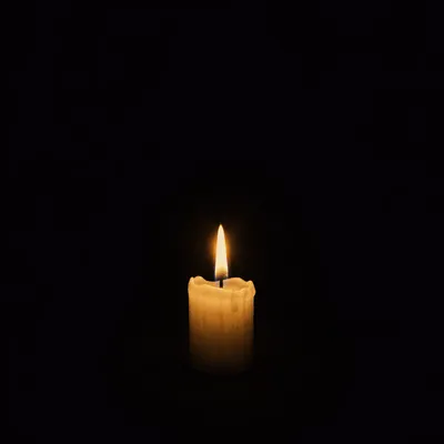 Single Candle Flame in Quiet Faith