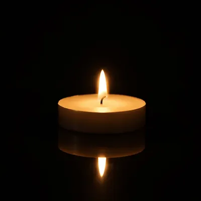 Burning Candle in Quiet Darkness