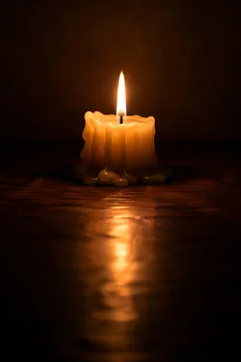 Burning Candle of Faith in Darkness