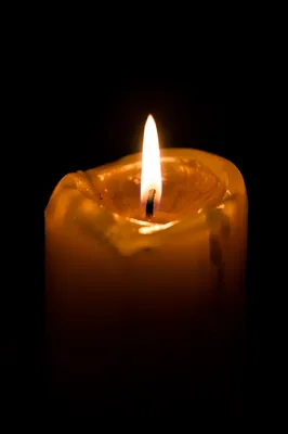 Burning Candle in Quiet Darkness