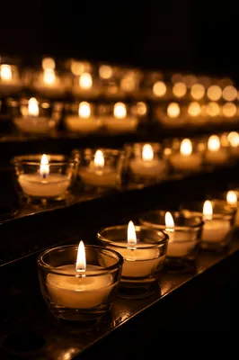 Burning Votive Candles in Quiet Faith