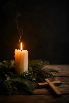Burning Candle of Faith with Evergreen Cross