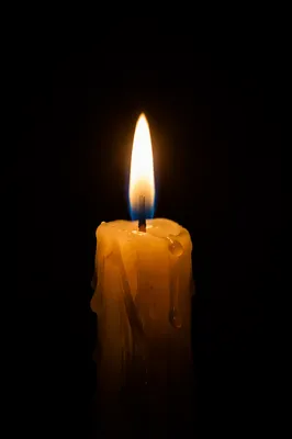 Burning Candle in Quiet Darkness