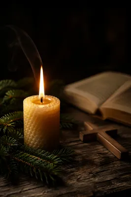 Burning Candle with Evergreen Faith Cross