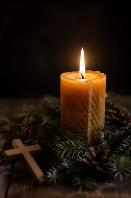 Burning Beeswax Candle with Evergreen Cross